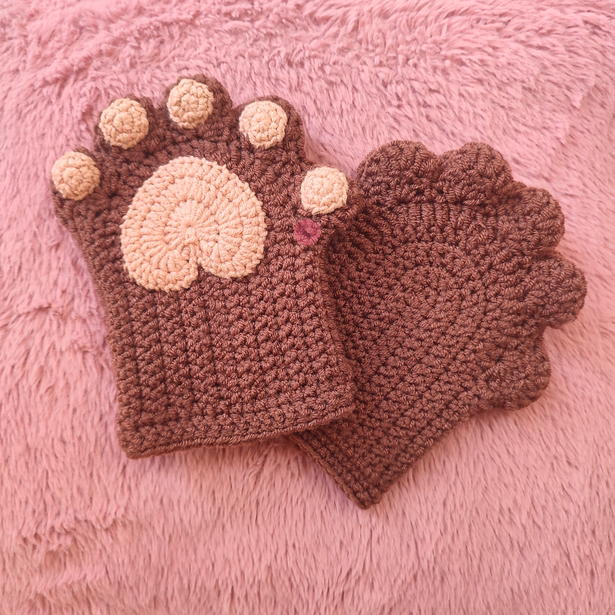 Brown crochet gloves with bear paw design for winter walks