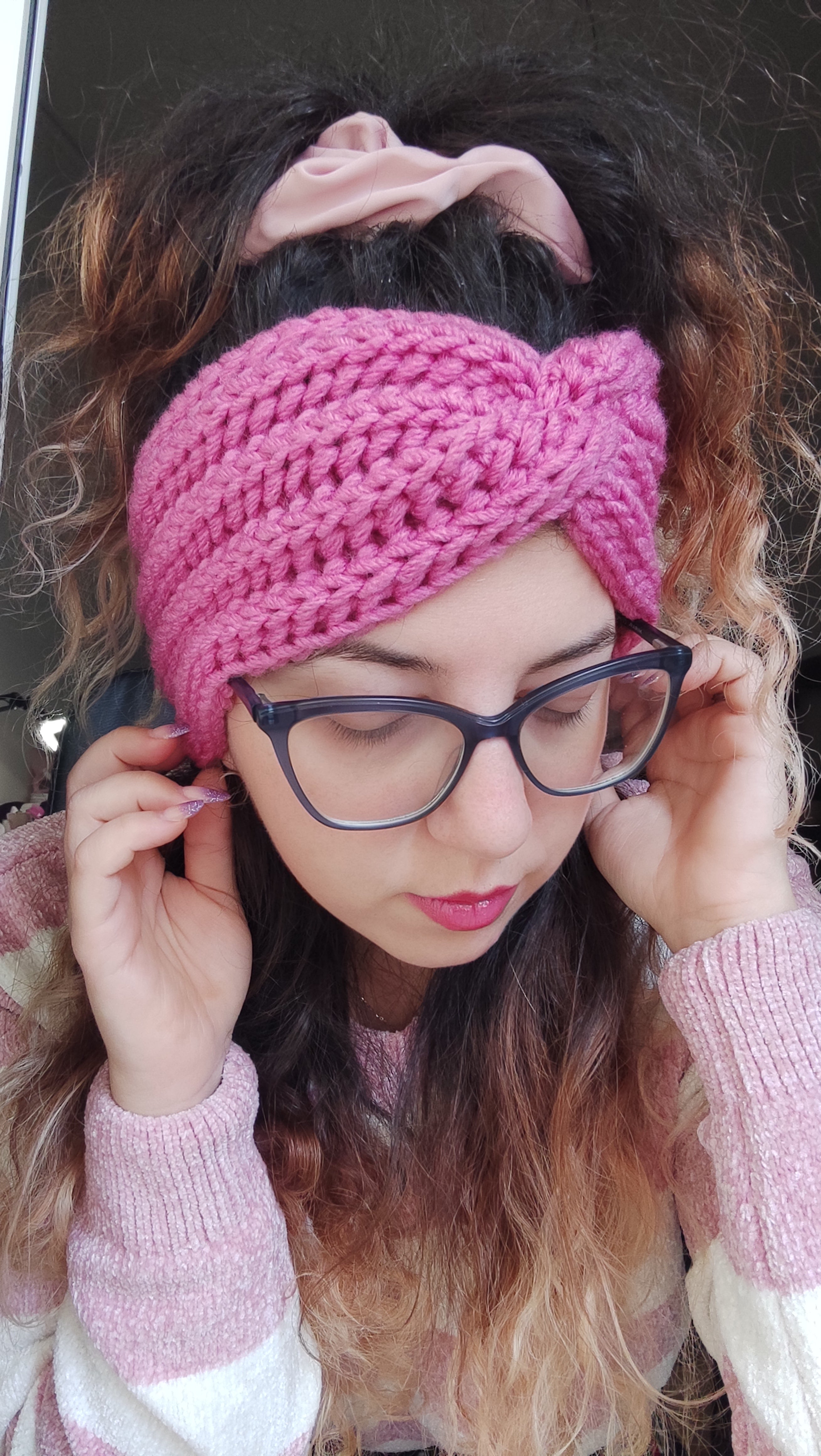 handmade chunky crochet headband worn by woman